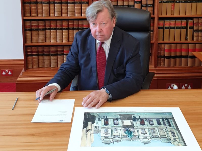 Lord Carloway signs the limited edition print and letter of authenticity
